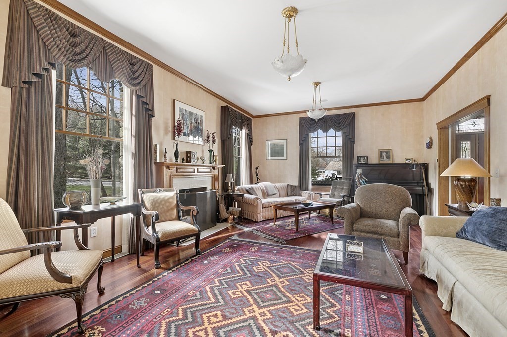 59 Crestview Road Milton, MA 02186 - Photo 3 of 32 a living room with furniture fireplace and large windows