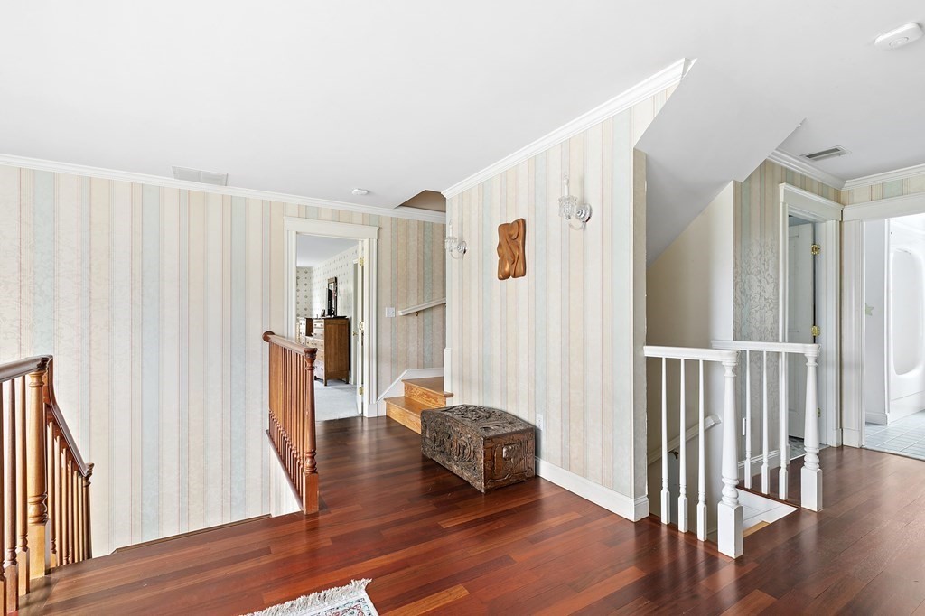 59 Crestview Road Milton, MA 02186 - Photo 10 of 32 a living room with wooden floors and a rug