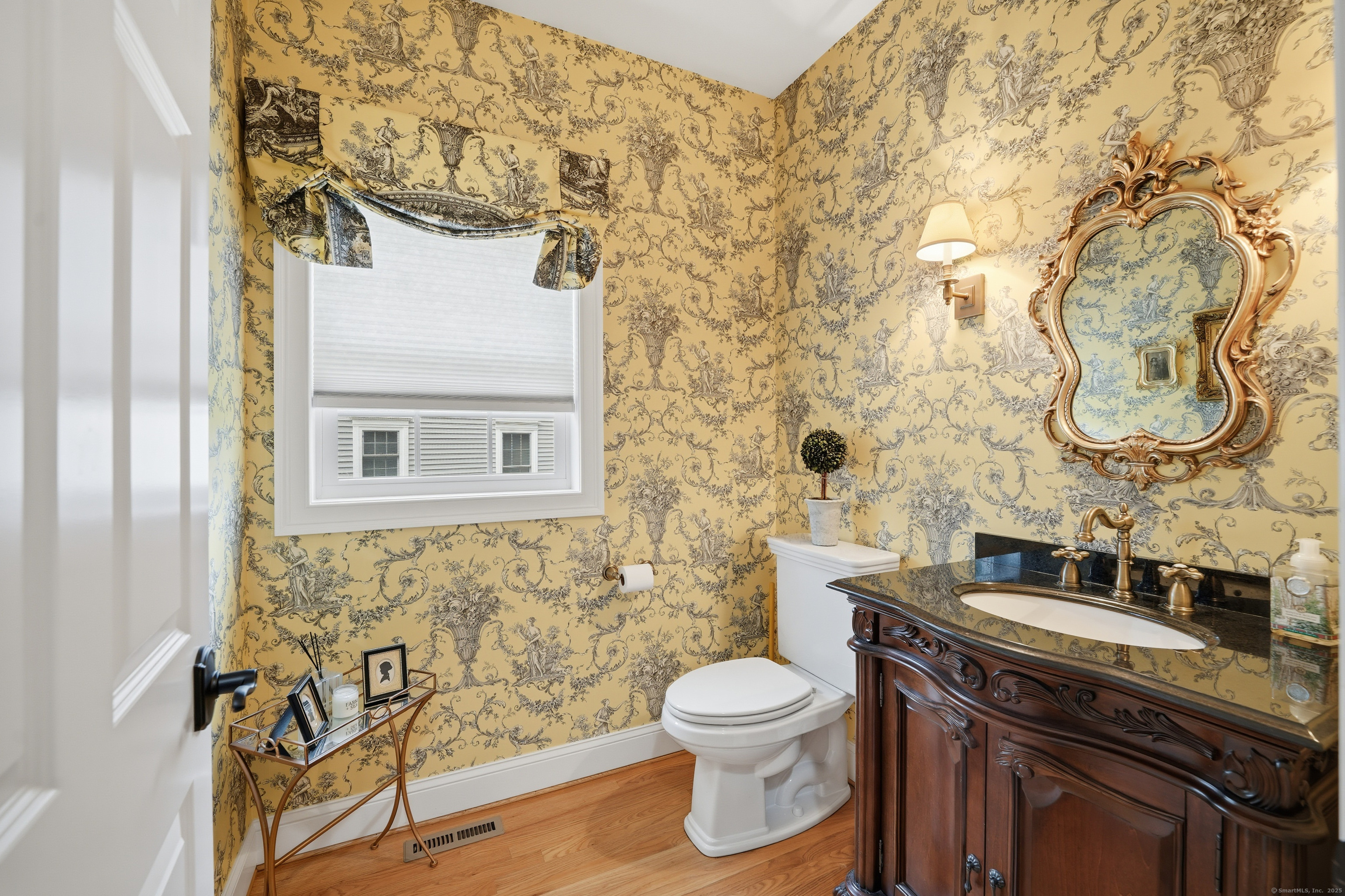 20 Greendale Drive Suffield, CT 06078 - Photo 11 of 36 a bathroom with a toilet sink and mirror