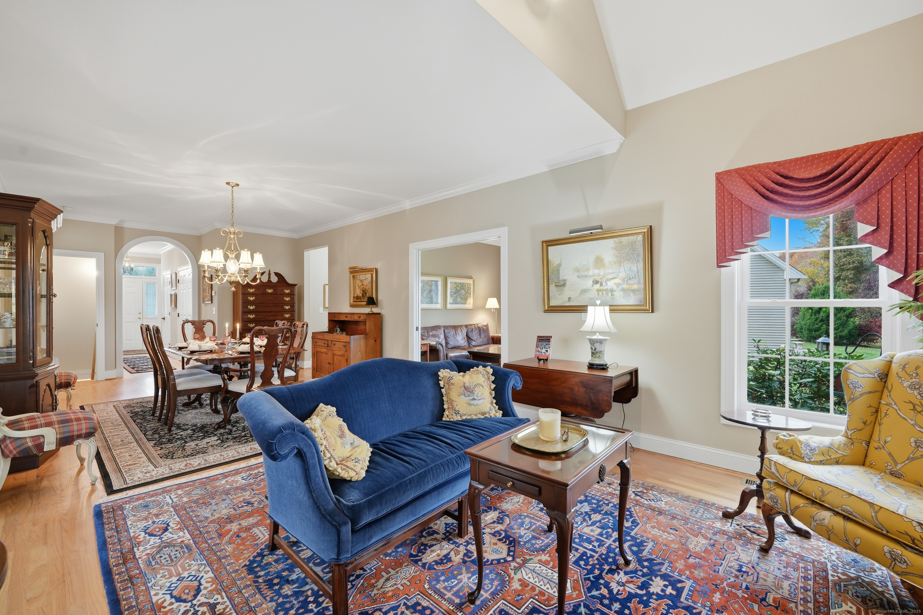 20 Greendale Drive Suffield, CT 06078 - Photo 13 of 36 a living room with furniture and a chandelier