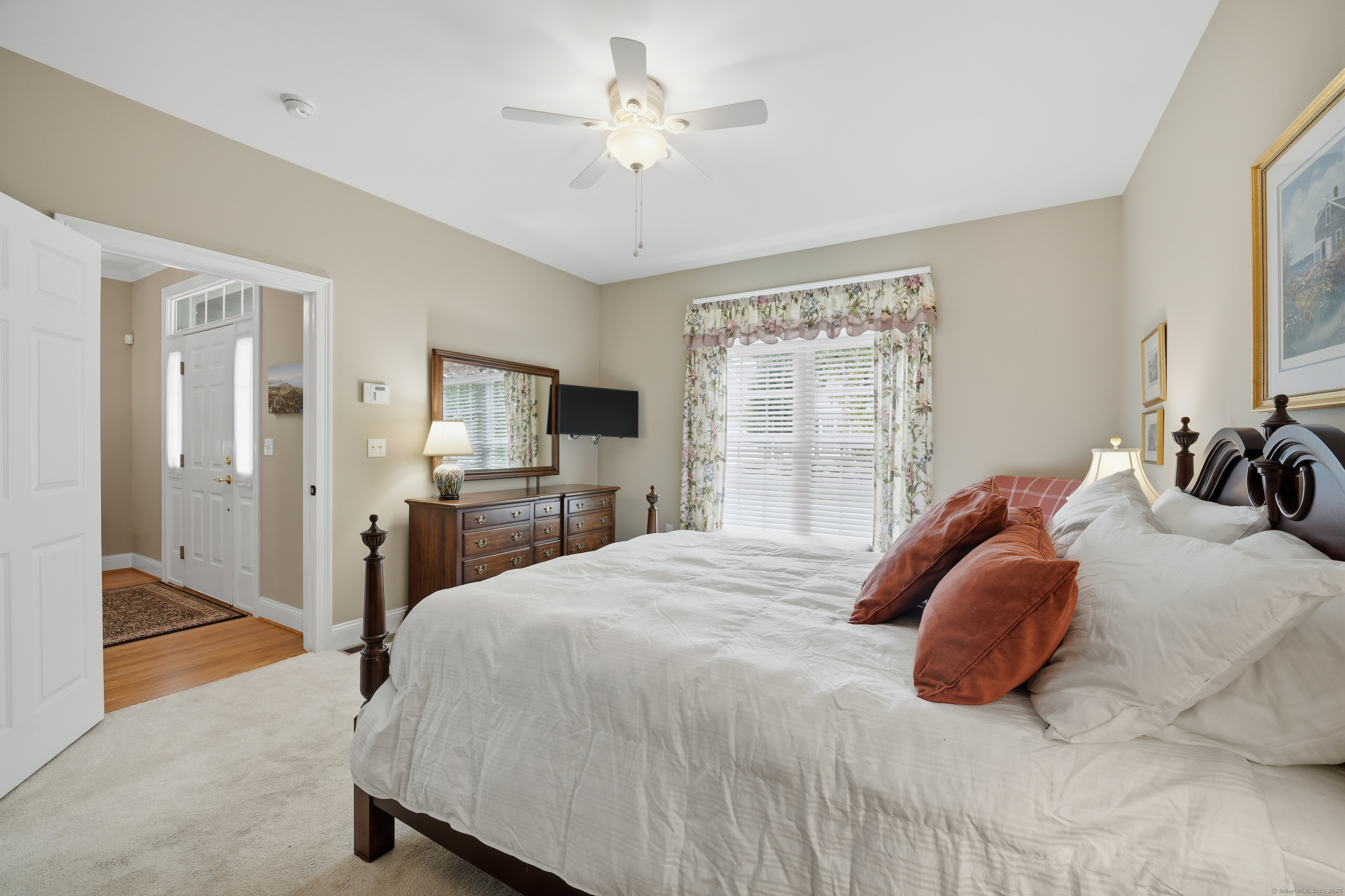 20 Greendale Drive Suffield, CT 06078 - Photo 18 of 36 a bedroom with a bed and a chandelier