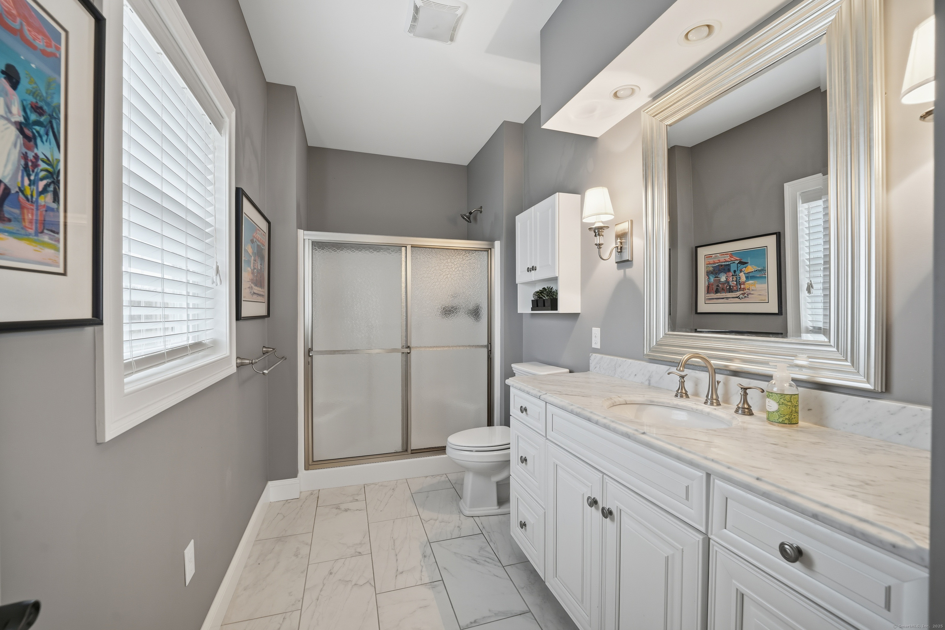 20 Greendale Drive Suffield, CT 06078 - Photo 19 of 36 a spacious bathroom with a double vanity sink toilet mirror and shower