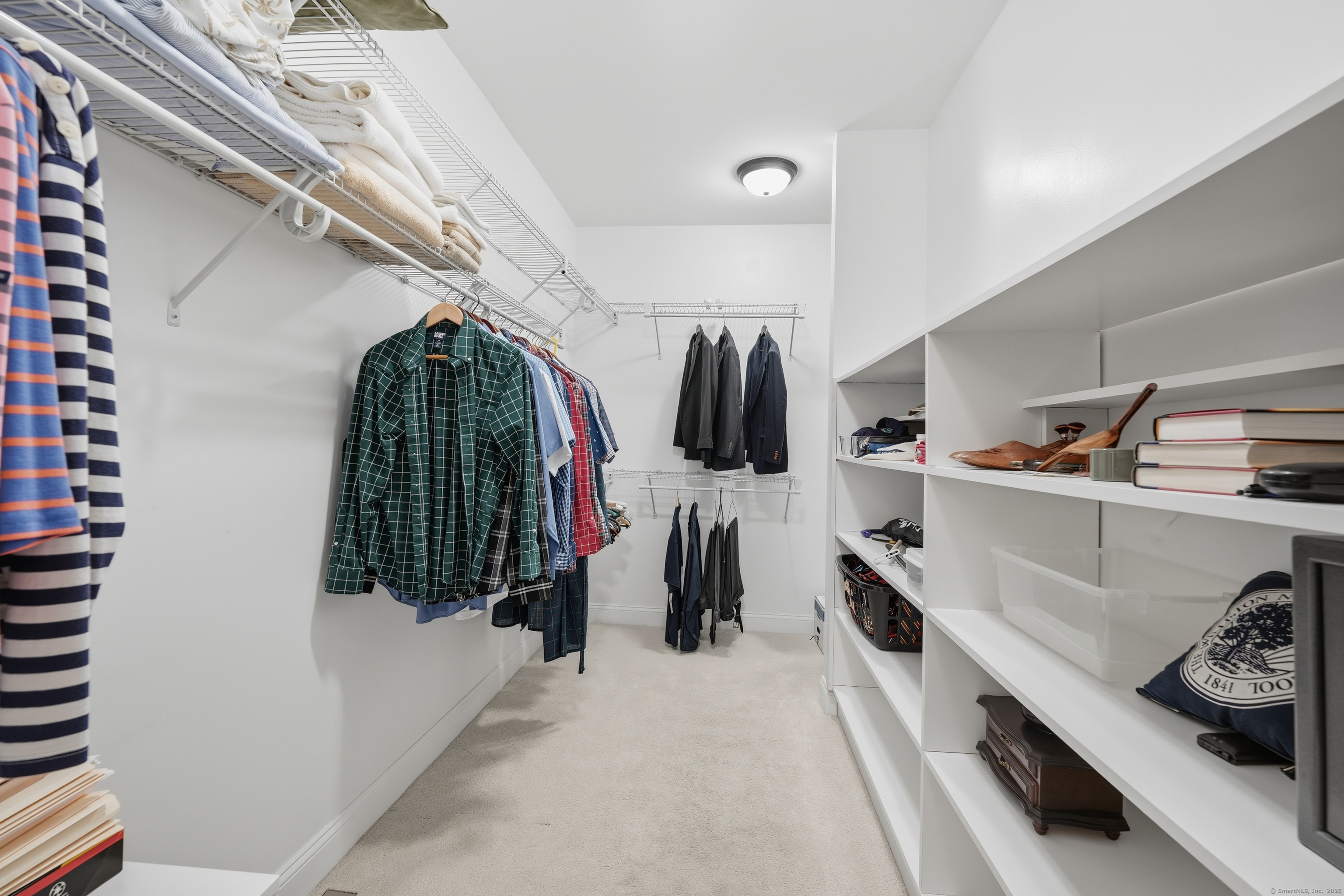 20 Greendale Drive Suffield, CT 06078 - Photo 20 of 36 a view of walk in closet with clothes and shoes