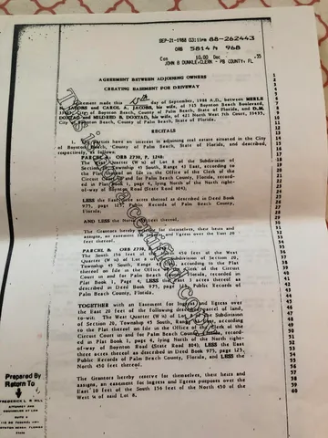 a view of a backyard with plants and outdoor seating