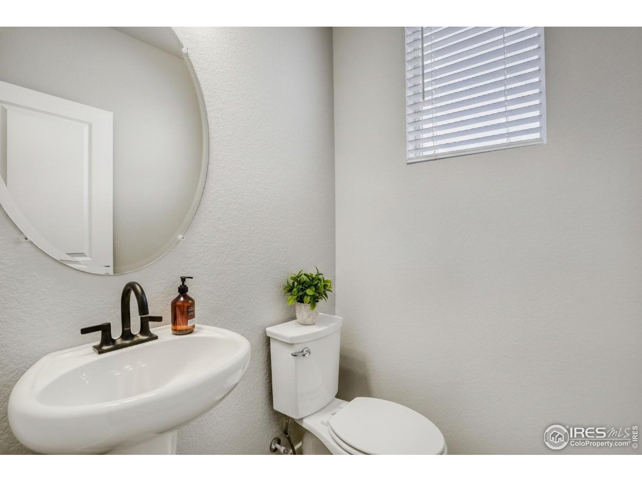 2385 East Suniga Road Fort Collins, CO 80524 - Photo 14 of 28 First level powder room
