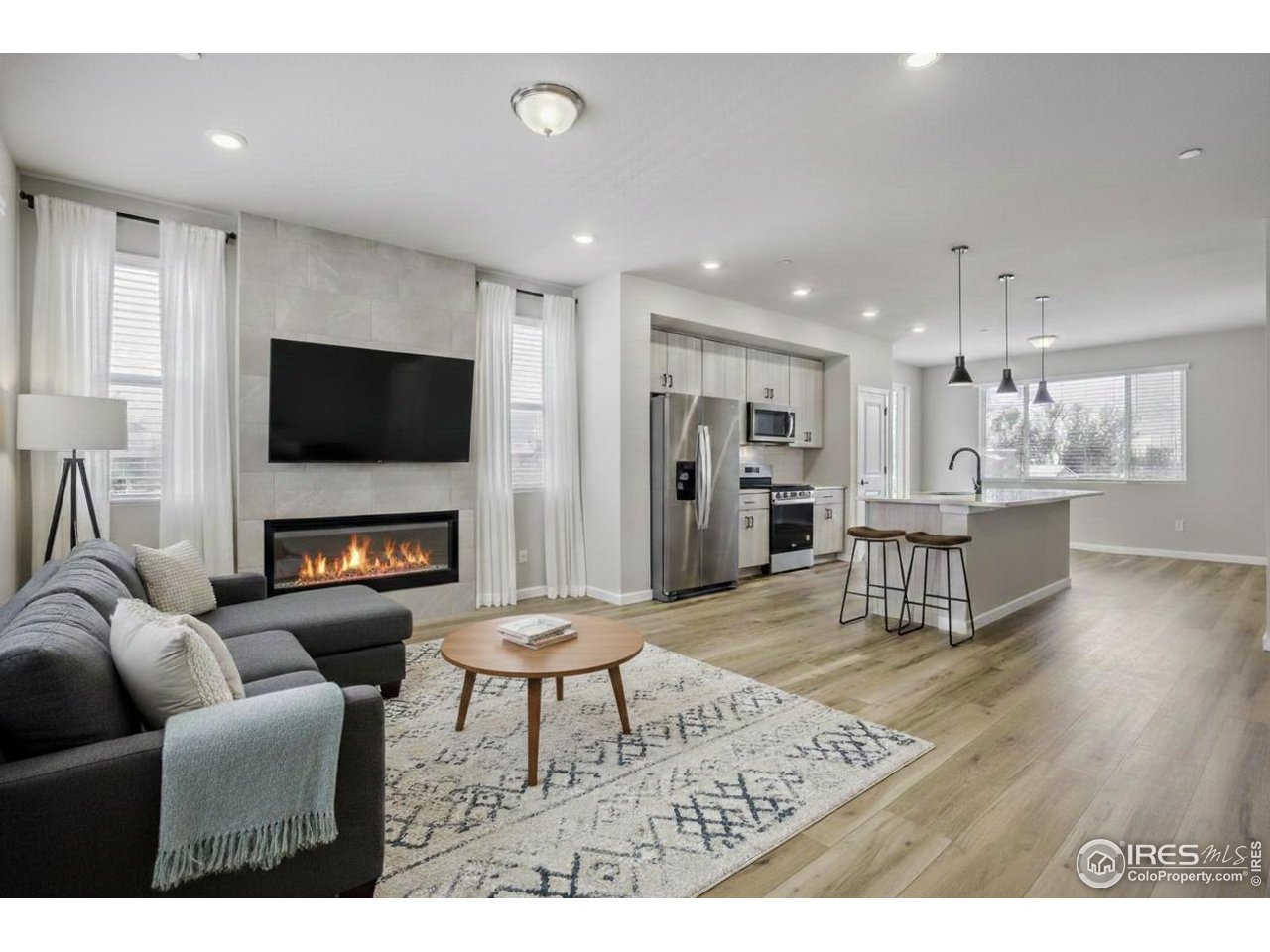 2385 East Suniga Road Fort Collins, CO 80524 - Photo 4 of 28 Great room centered by a cozy fireplace