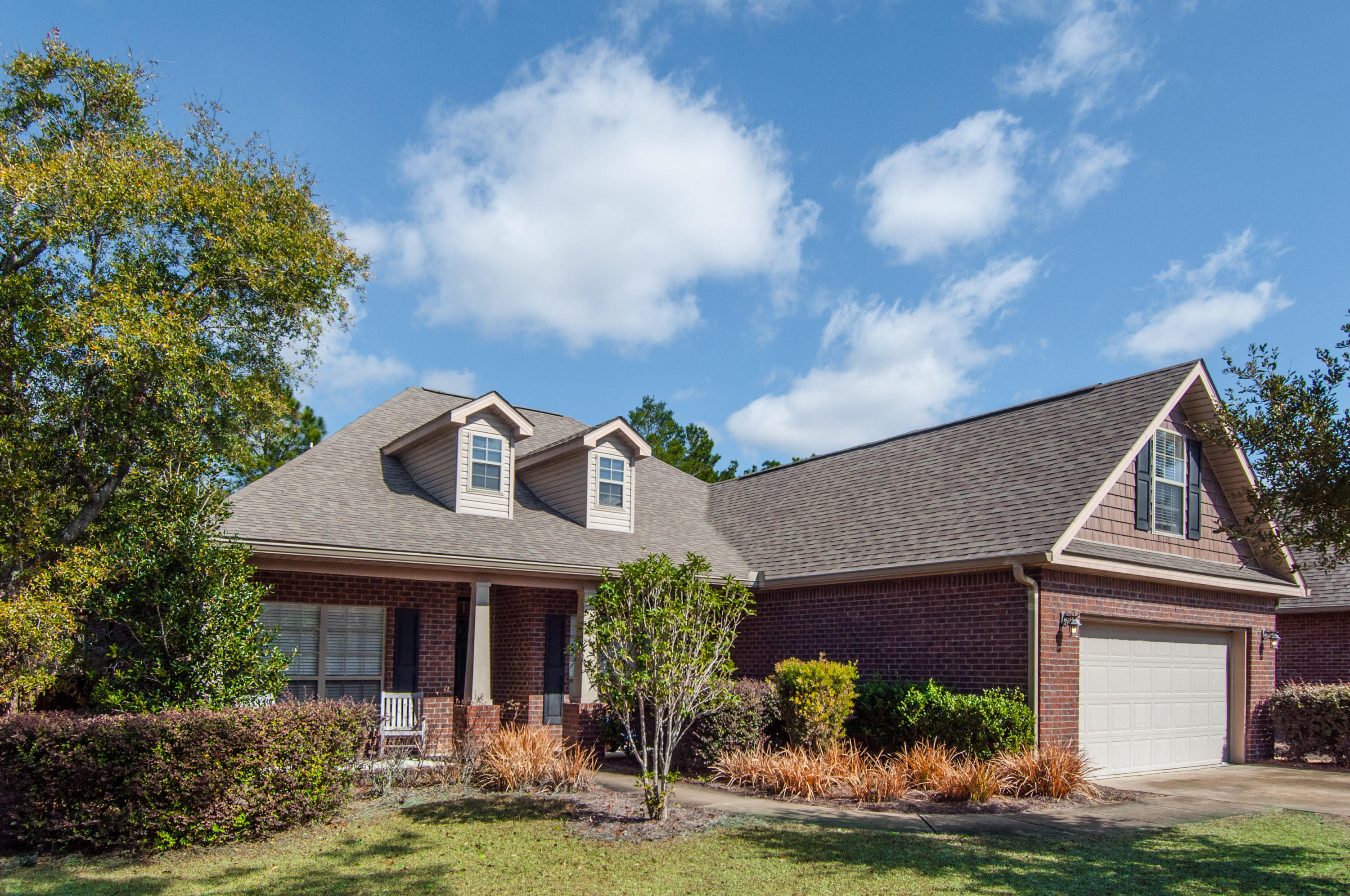93 Mango Lane Freeport, FL 32439 - Photo 1 of 45 a front view of a house with garden