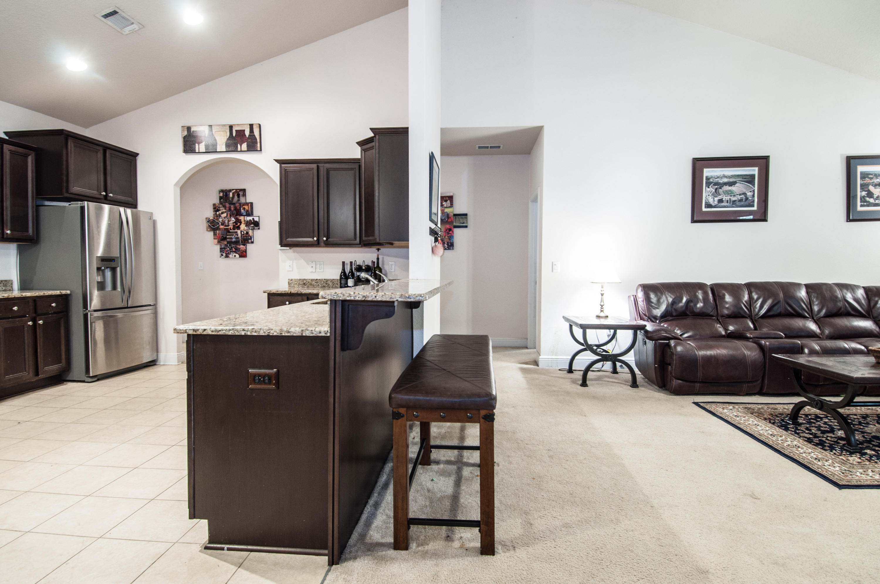 93 Mango Lane Freeport, FL 32439 - Photo 12 of 45 a kitchen with a refrigerator and a sink