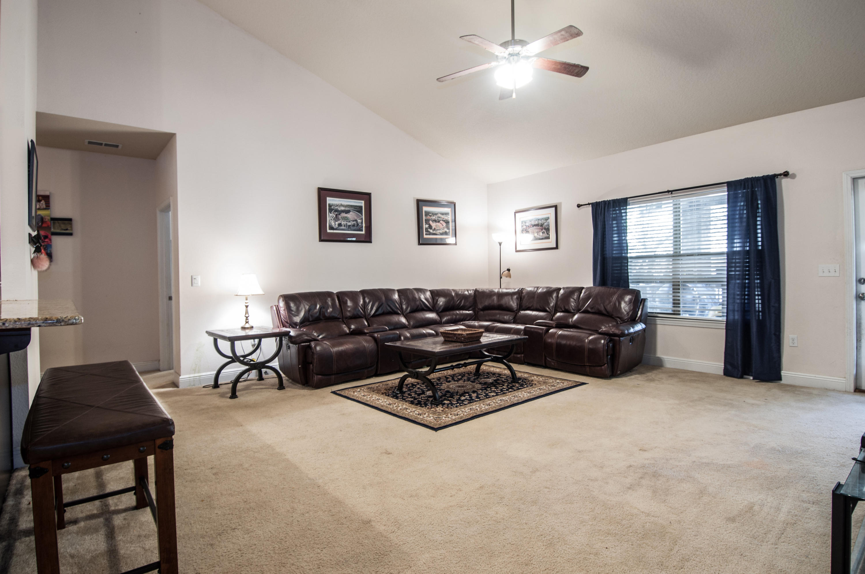 93 Mango Lane Freeport, FL 32439 - Photo 13 of 45 a living room with furniture a chandelier and a window