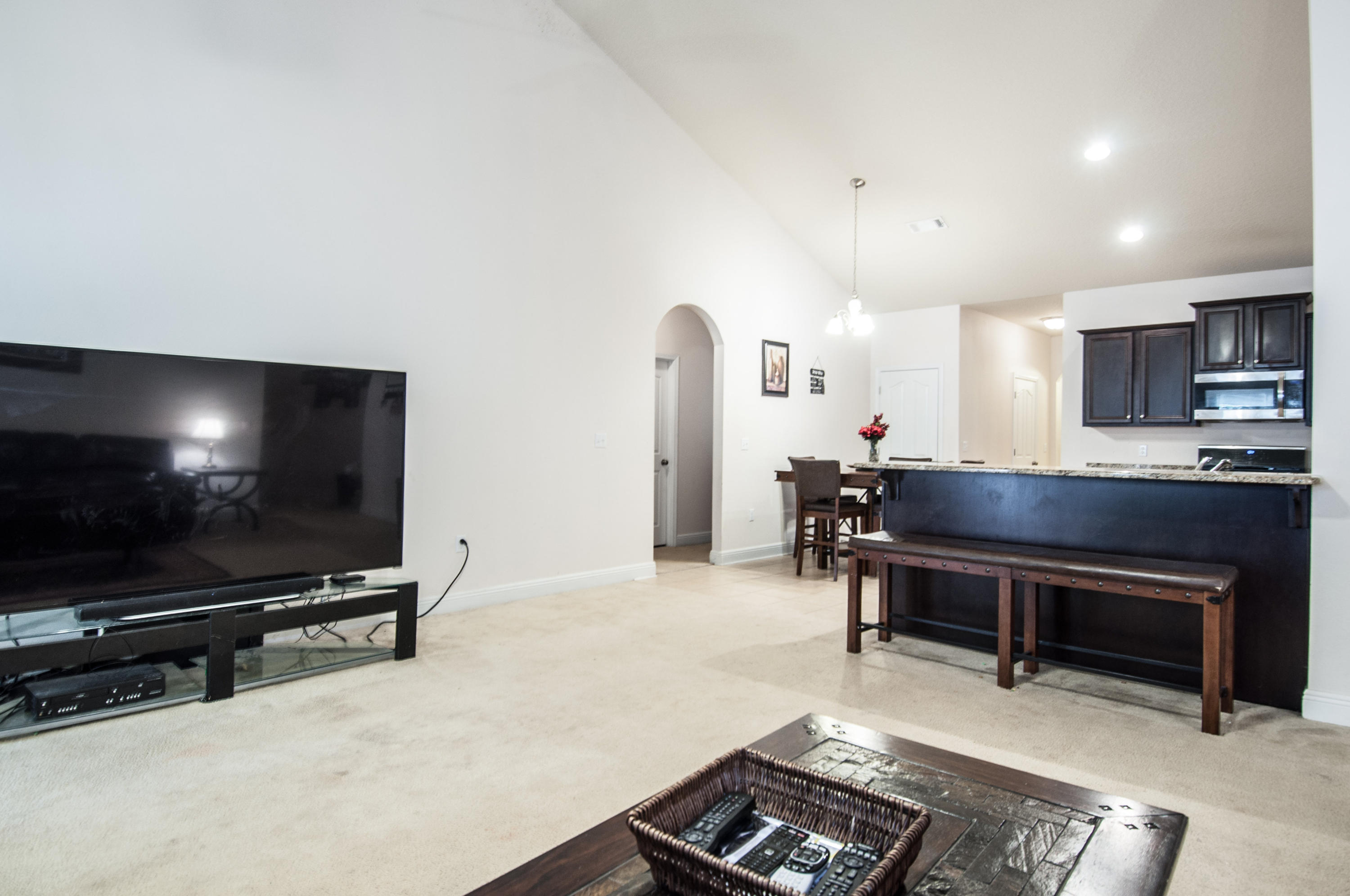 93 Mango Lane Freeport, FL 32439 - Photo 15 of 45 a living room with furniture and a flat screen tv