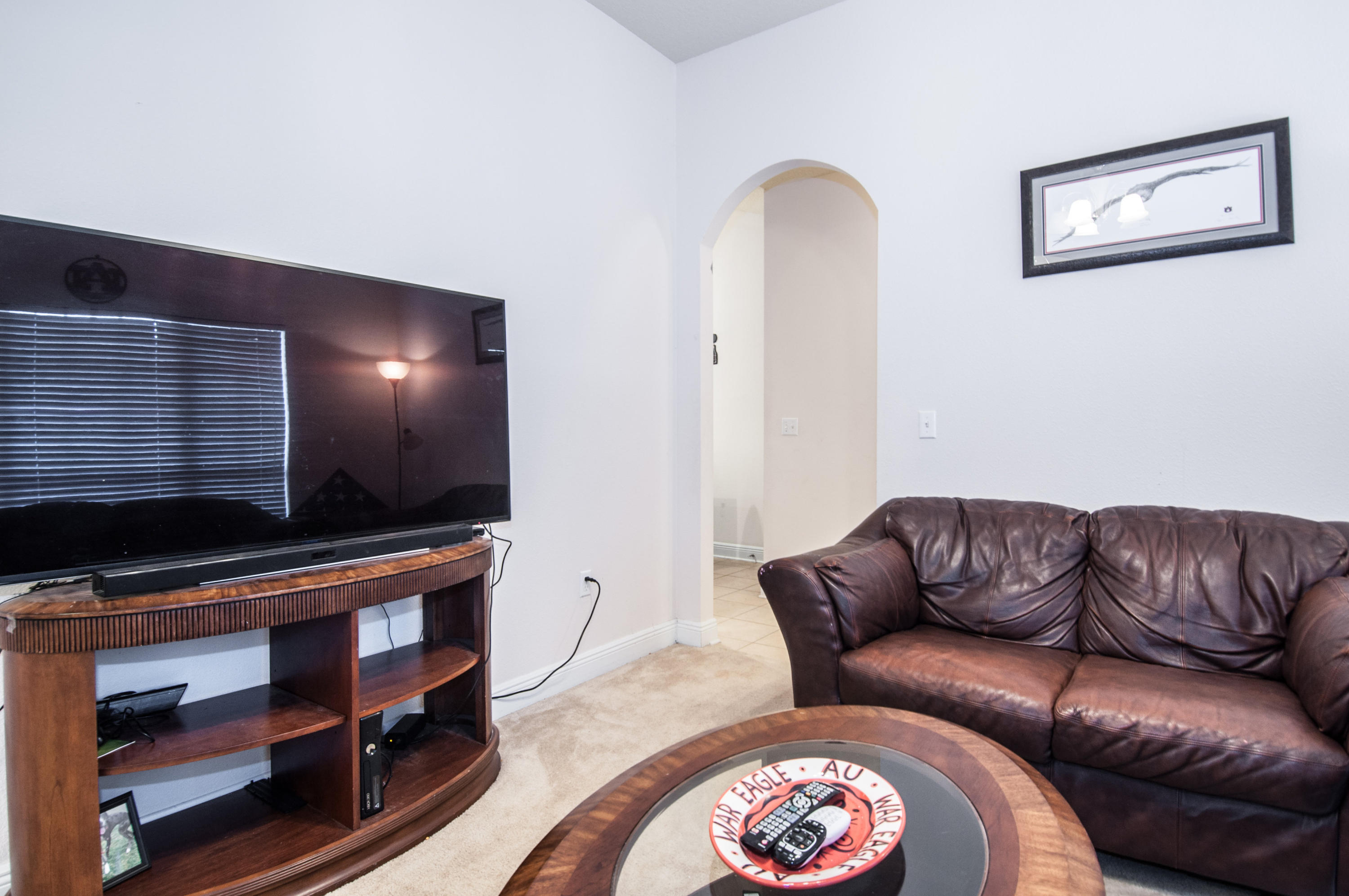 93 Mango Lane Freeport, FL 32439 - Photo 20 of 45 a living room with furniture and a flat screen tv