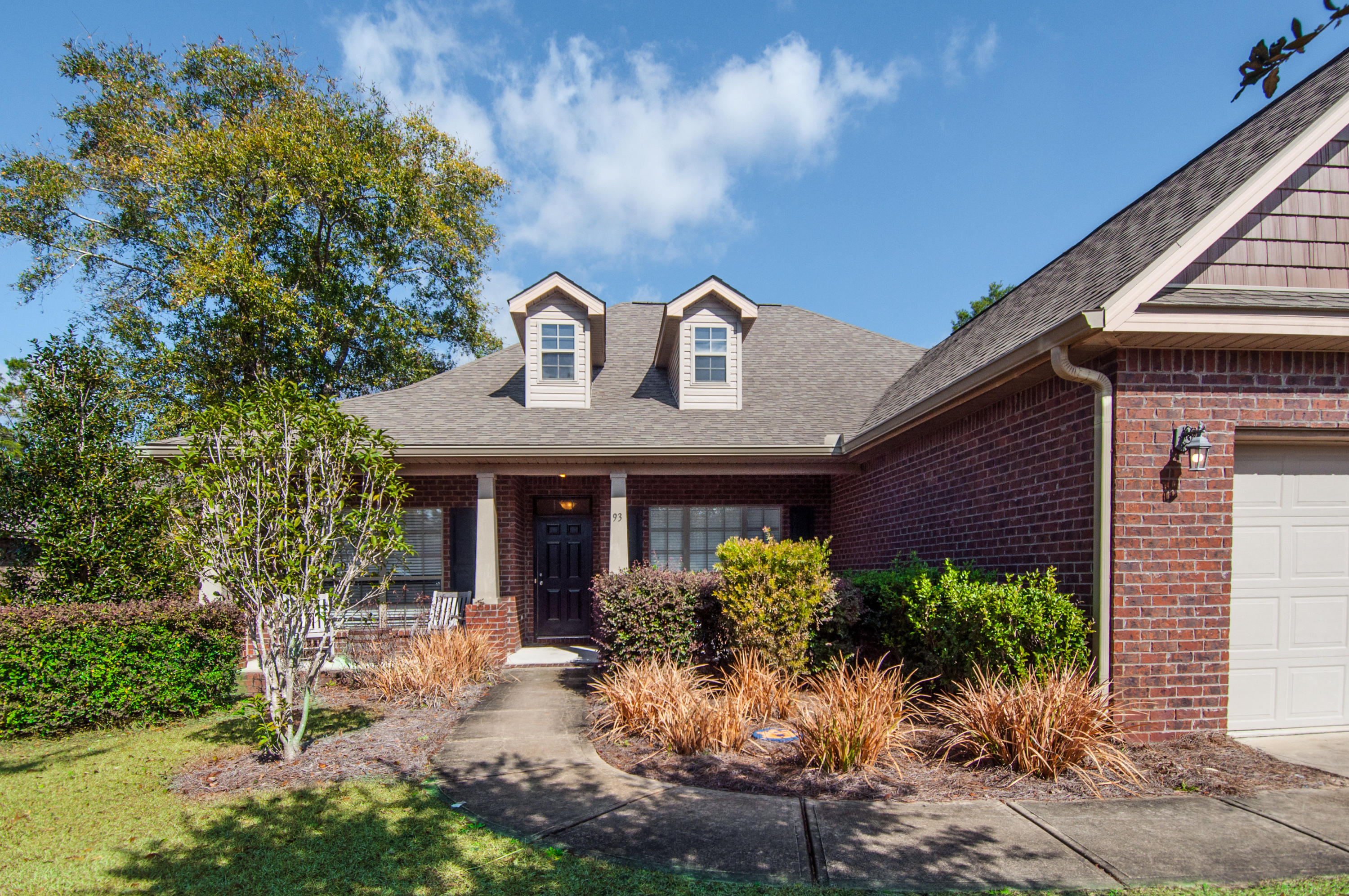 93 Mango Lane Freeport, FL 32439 - Photo 2 of 45 a front view of a house with garden