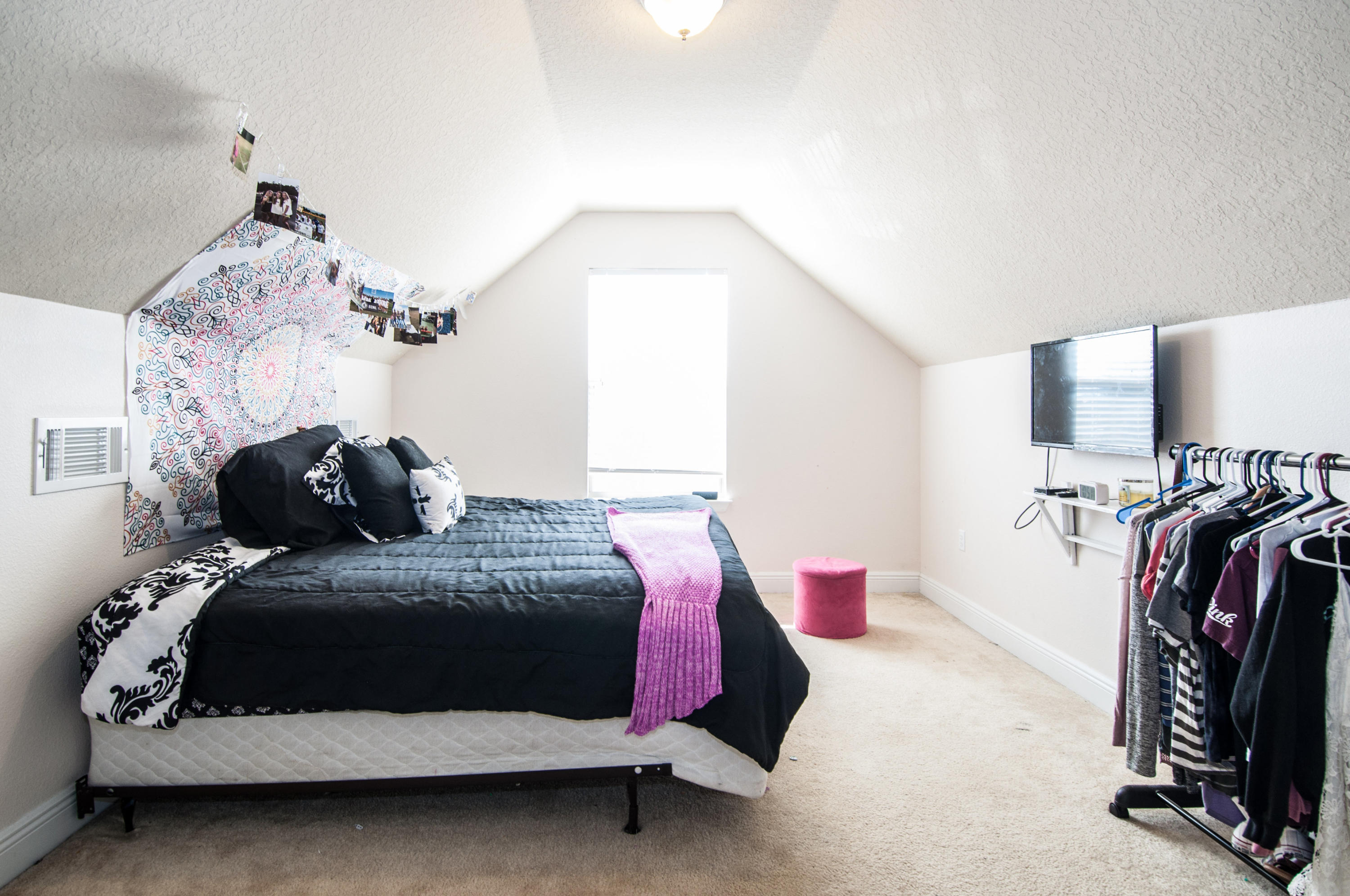 93 Mango Lane Freeport, FL 32439 - Photo 23 of 45 a bedroom with a bed and a mirror