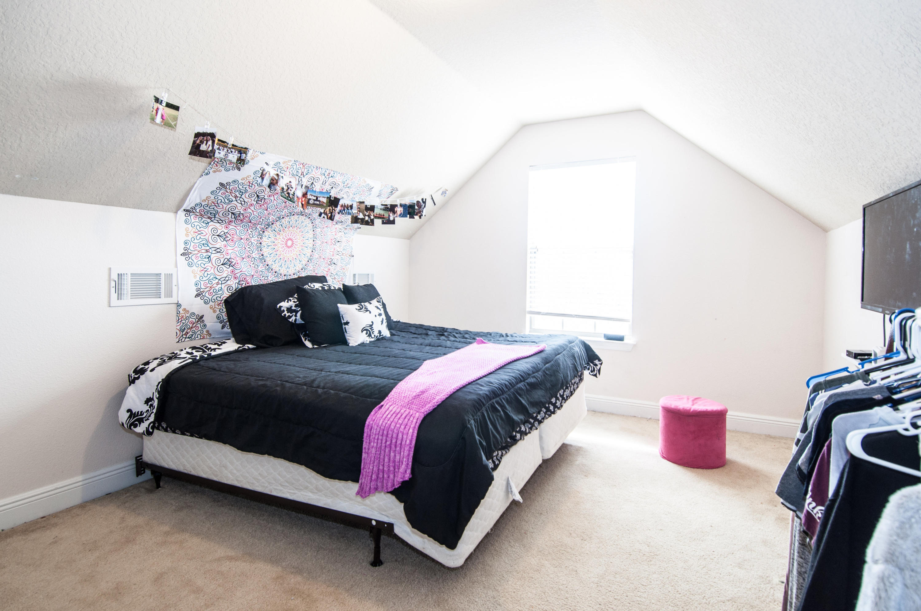 93 Mango Lane Freeport, FL 32439 - Photo 24 of 45 a bedroom with a bed and a chandelier