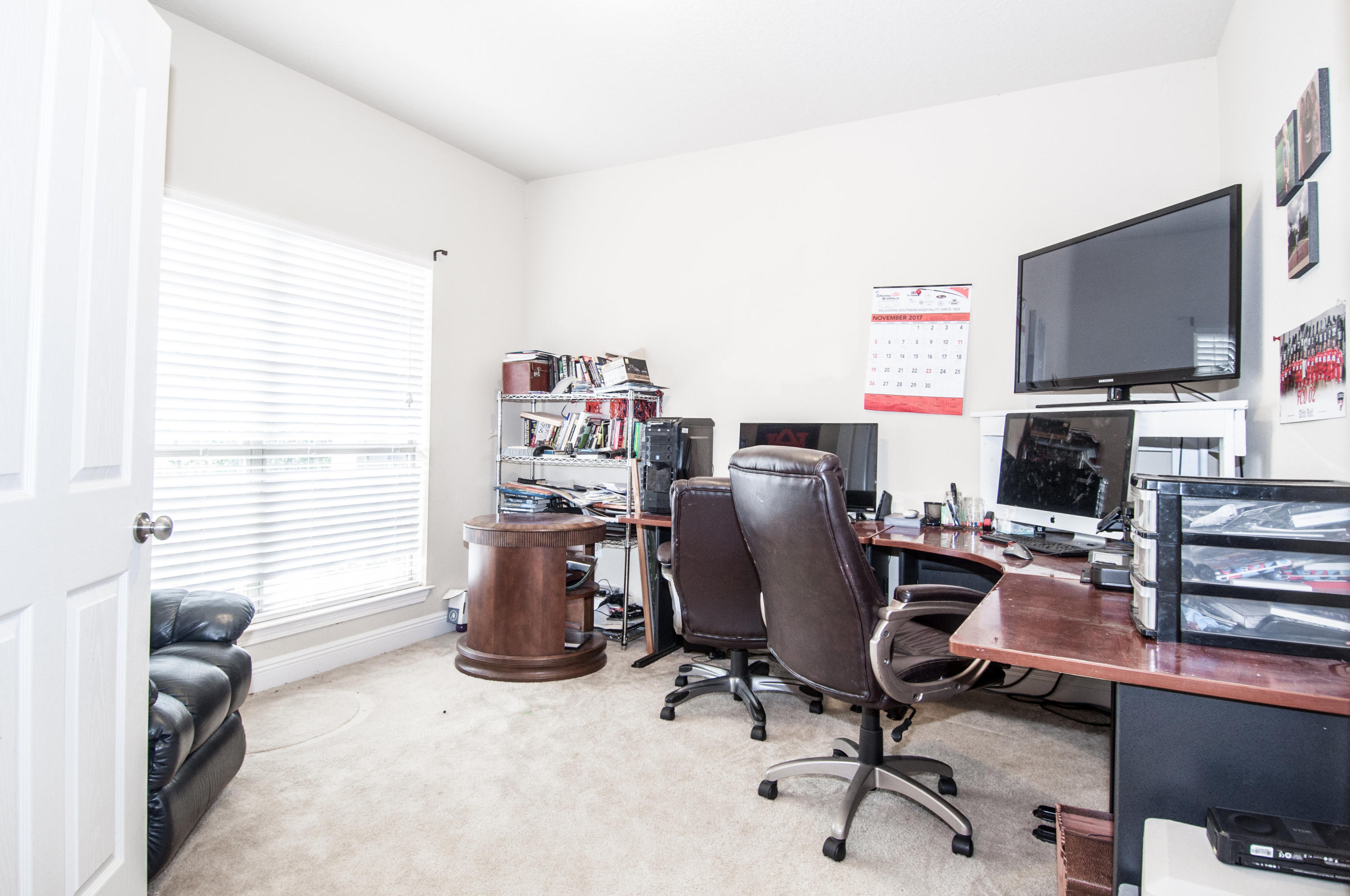 93 Mango Lane Freeport, FL 32439 - Photo 26 of 45 a view of a workspace with furniture and a window