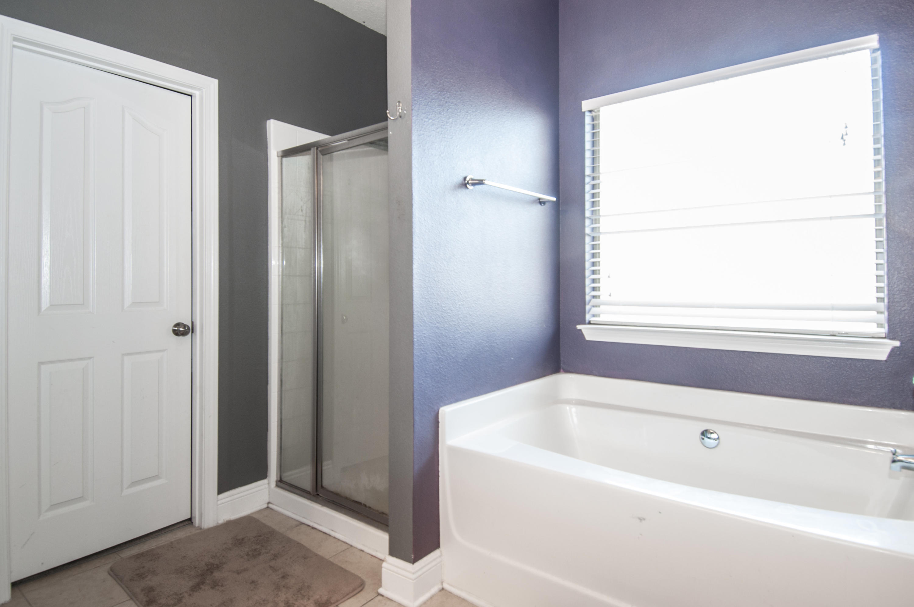 93 Mango Lane Freeport, FL 32439 - Photo 36 of 45 a white bath tub sitting next to a window
