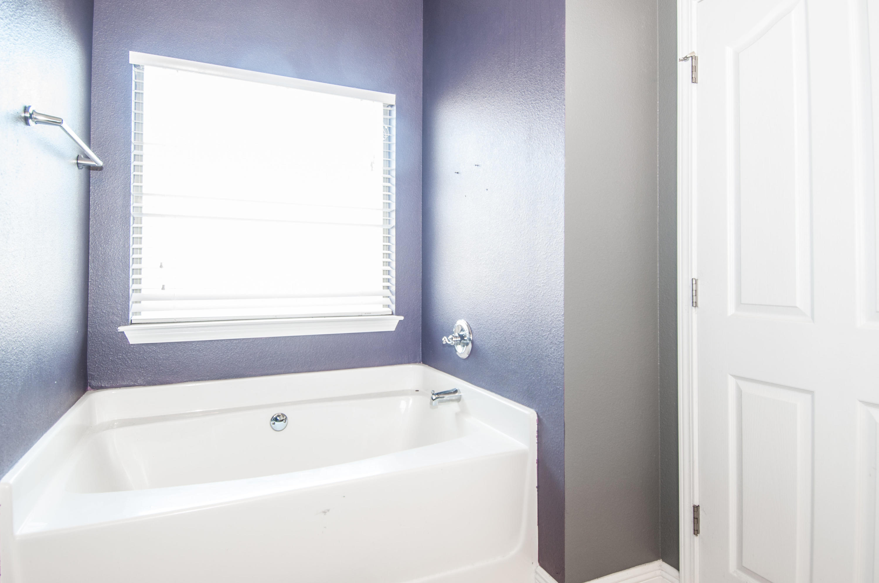 93 Mango Lane Freeport, FL 32439 - Photo 37 of 45 a white bath tub sitting next to a window