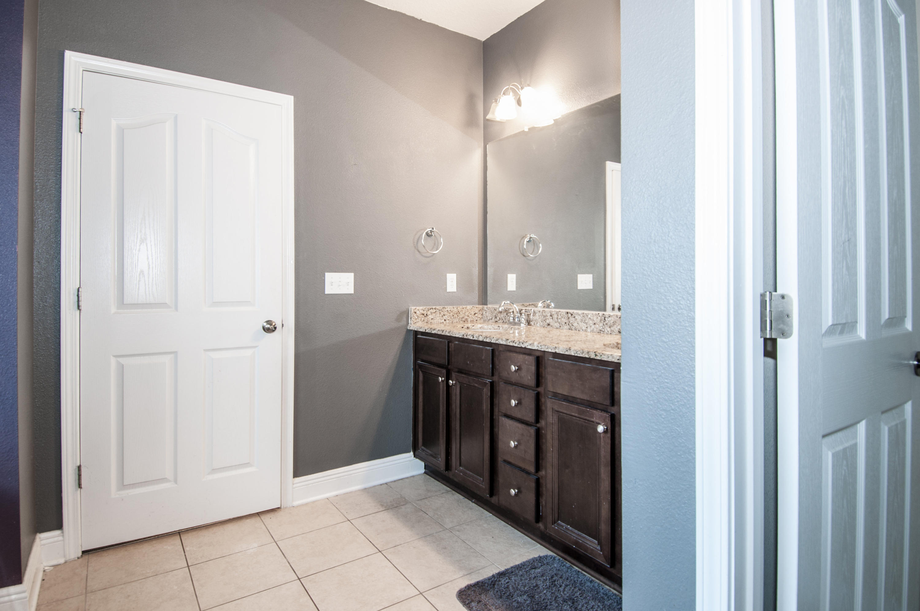 93 Mango Lane Freeport, FL 32439 - Photo 38 of 45 a bathroom with a double vanity sink and a mirror