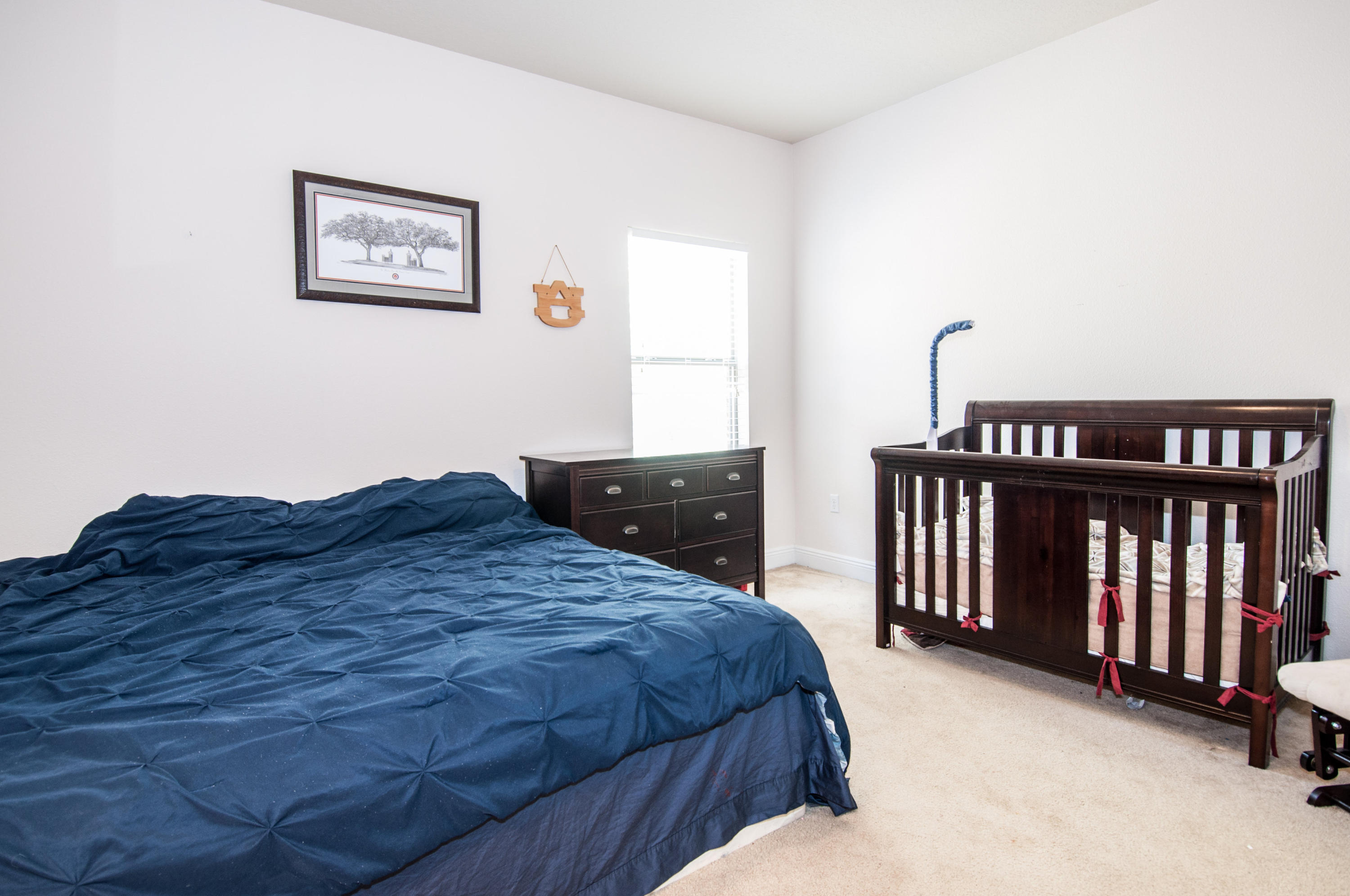 93 Mango Lane Freeport, FL 32439 - Photo 40 of 45 a bedroom with a bed and a window