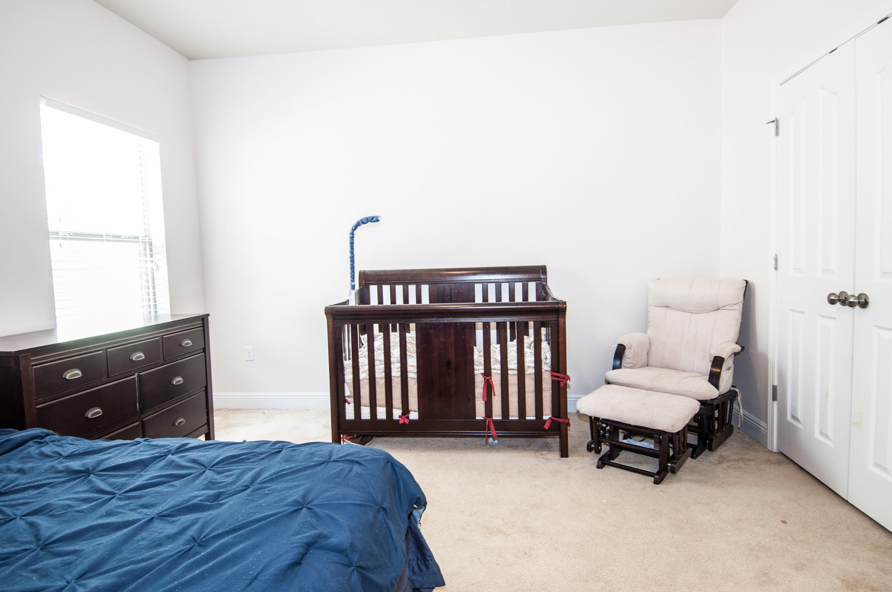 93 Mango Lane Freeport, FL 32439 - Photo 41 of 45 a bedroom with a bed and a dresser
