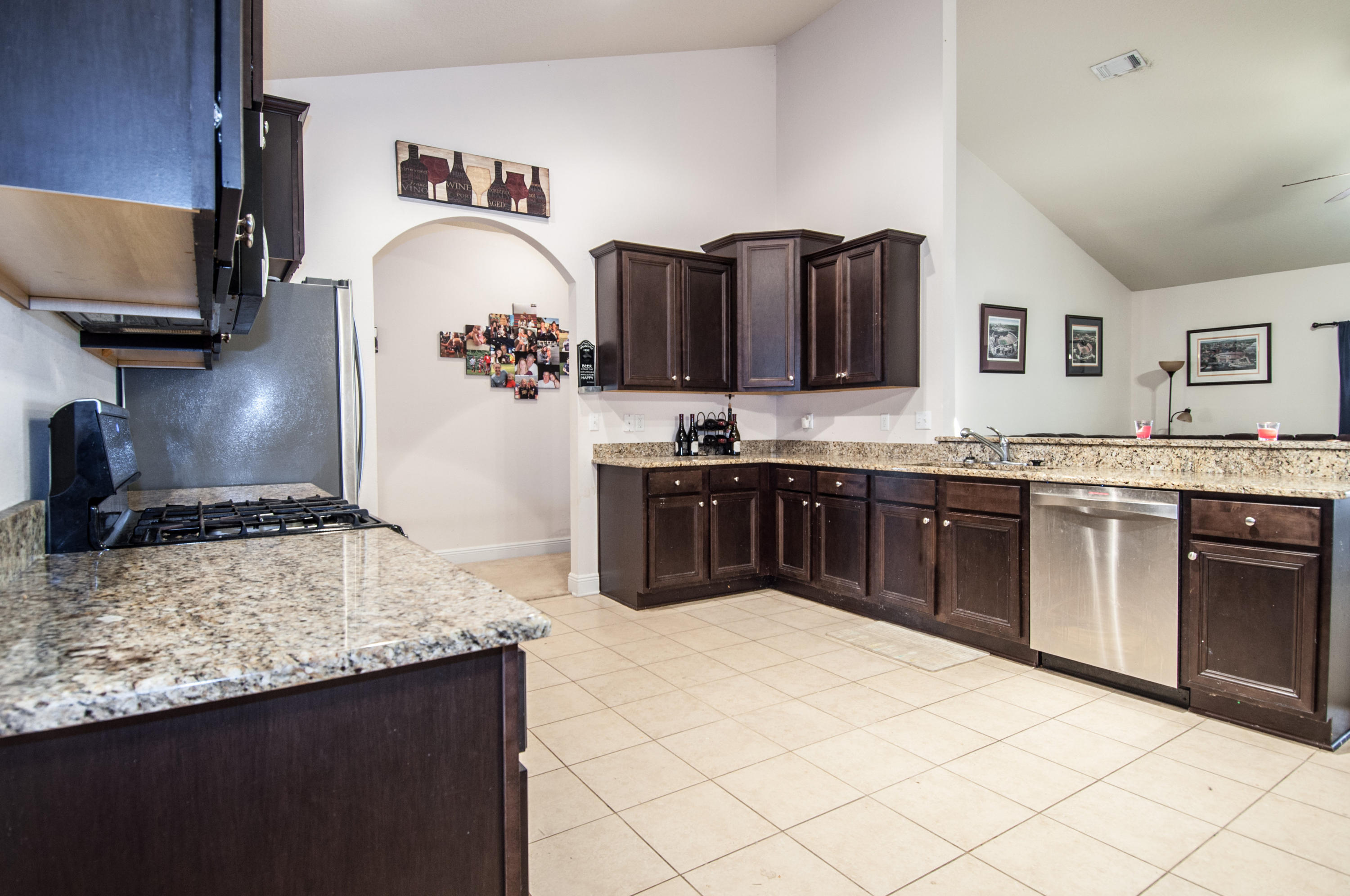 93 Mango Lane Freeport, FL 32439 - Photo 8 of 45 a kitchen with stainless steel appliances granite countertop a sink stove and cabinets