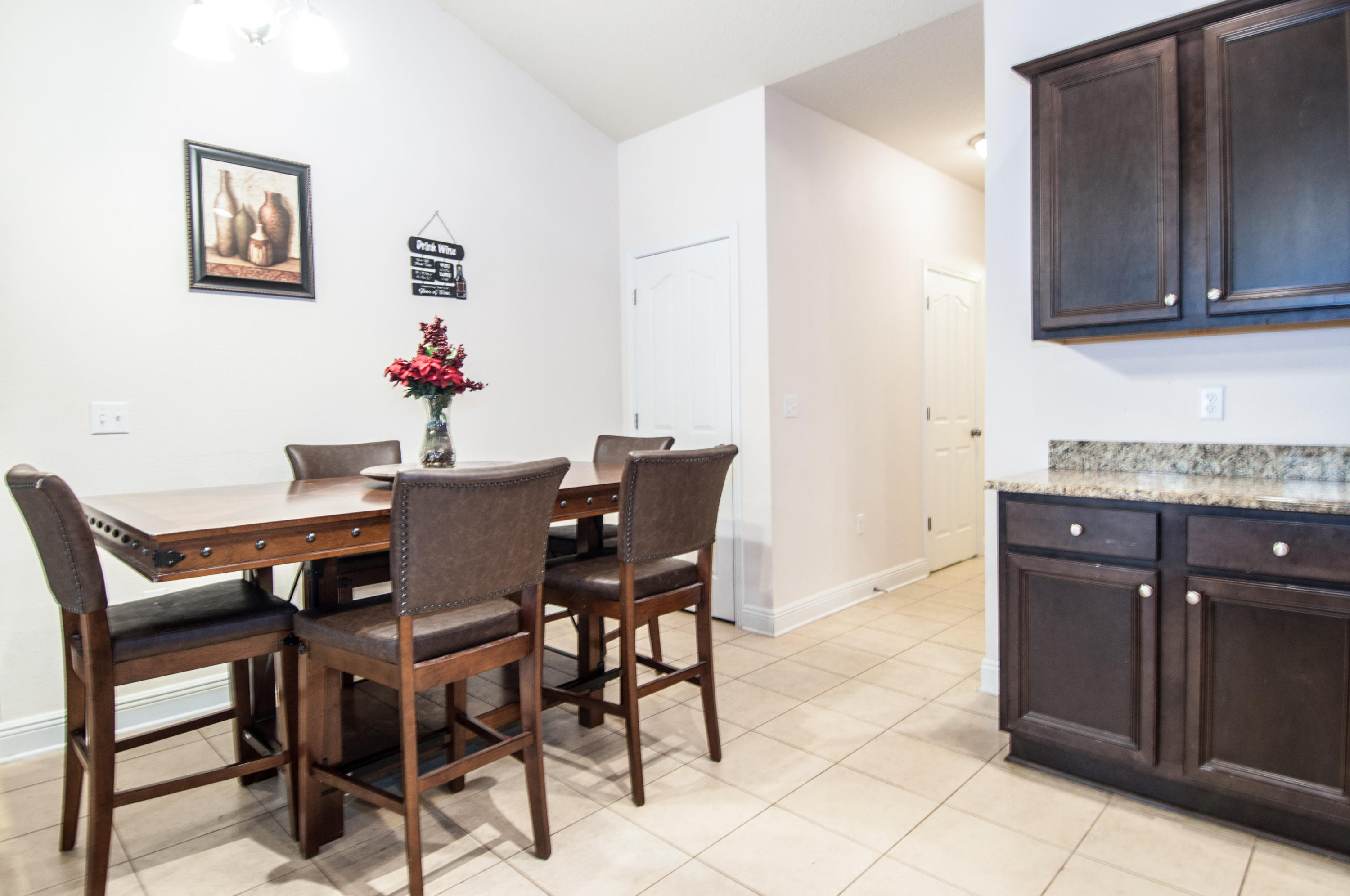 93 Mango Lane Freeport, FL 32439 - Photo 10 of 45 a view of a dining room with furniture