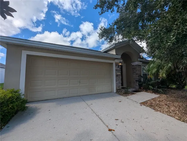 a view of a house with a tree