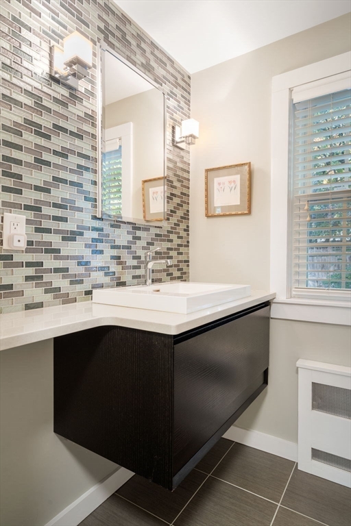 5 Halcyon Road Newton, MA 02459 - Photo 11 of 26 a bathroom with a sink and a mirror