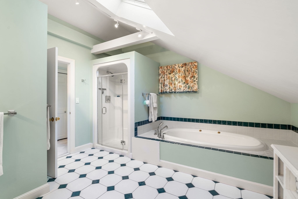 5 Halcyon Road Newton, MA 02459 - Photo 16 of 26 a bathroom with a bathtub and a shower