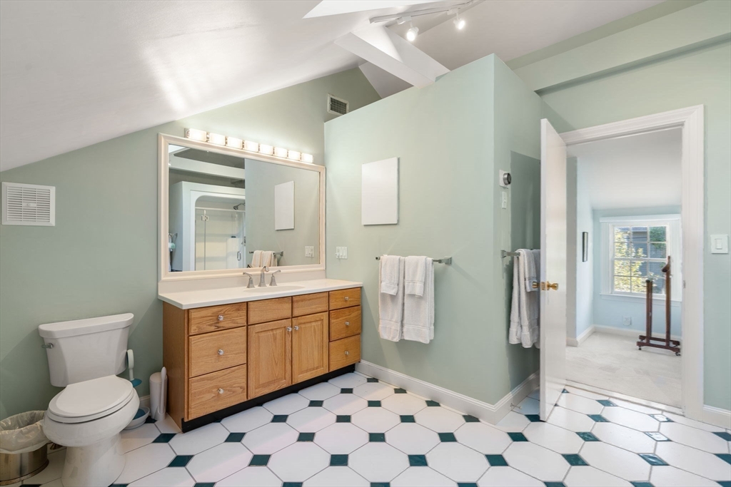 5 Halcyon Road Newton, MA 02459 - Photo 17 of 26 a bathroom with a sink a toilet and a mirror
