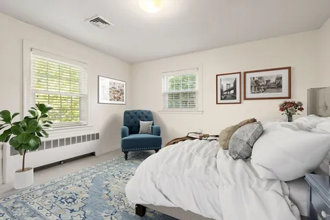 a bedroom with furniture and a bed