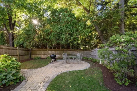 a view of a backyard with furniture