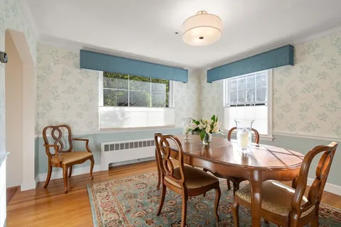 a view of a dining room with furniture and window
