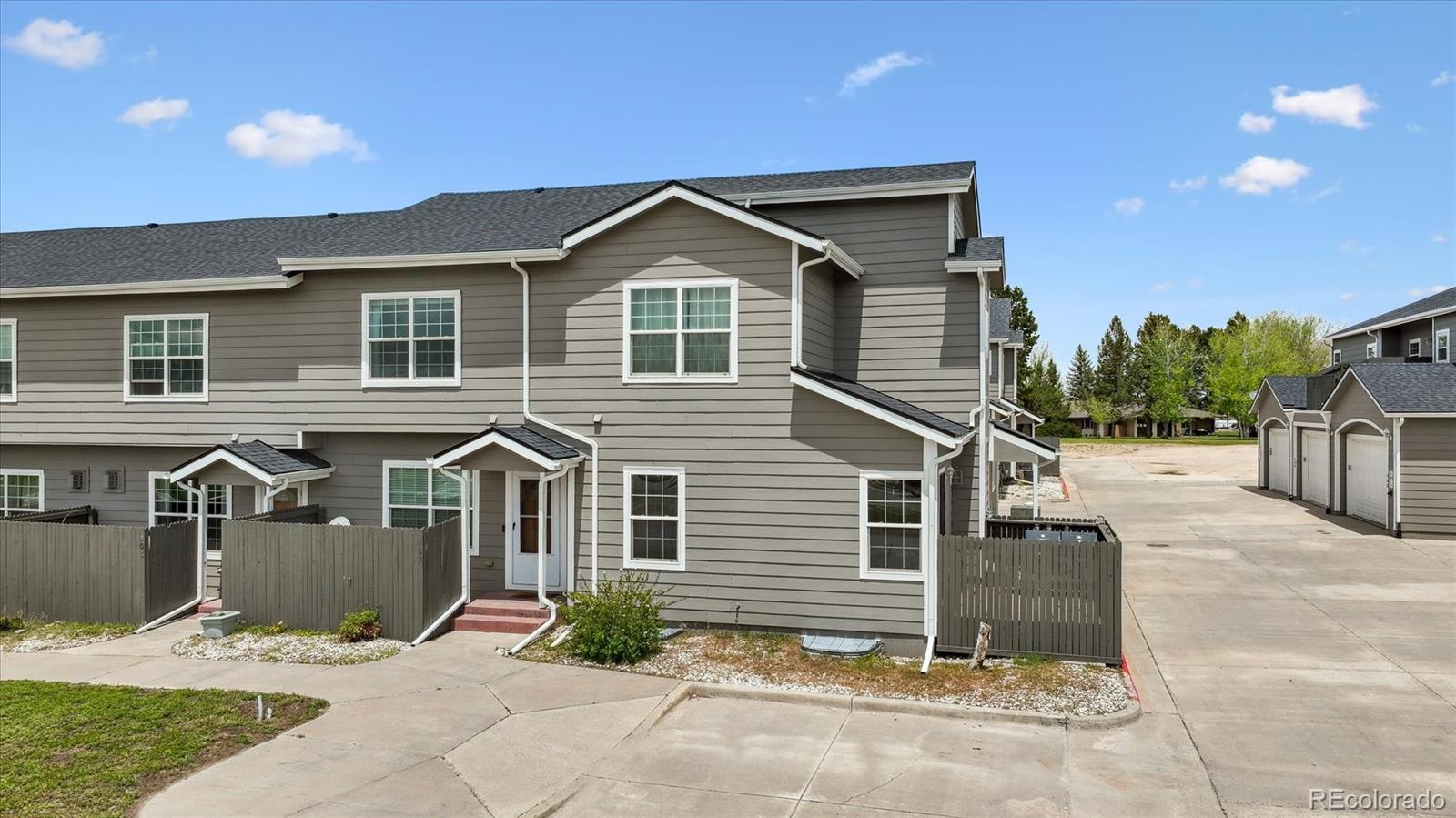 645 Yuma Loop, Unit 103 Kiowa, CO 80117 - Photo 2 of 23 a front view of a house with a yard