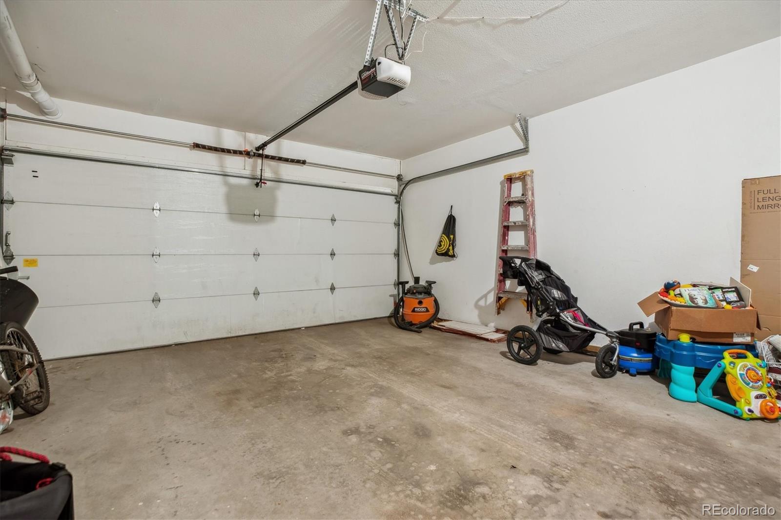 645 Yuma Loop, Unit 103 Kiowa, CO 80117 - Photo 22 of 23 a view of a garage with toys
