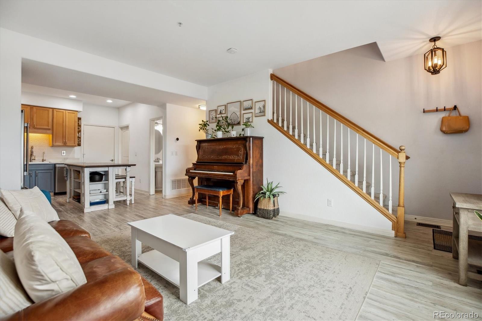 645 Yuma Loop, Unit 103 Kiowa, CO 80117 - Photo 6 of 23 a living room with furniture and a piano