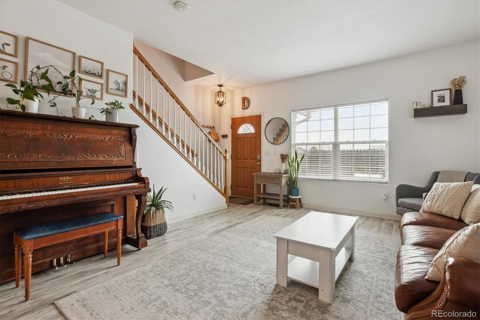 645 Yuma Loop, Unit 103 Kiowa, CO 80117 - Photo 7 of 23 a living room with furniture and a window