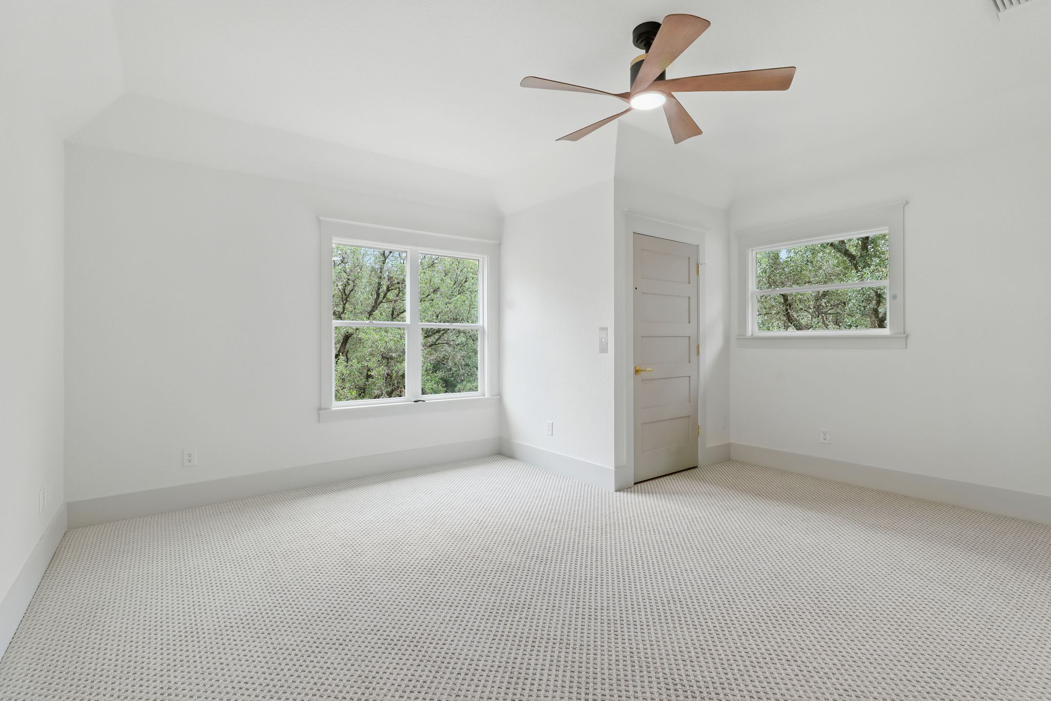 6905 Rudi Cove Austin, TX 78759 - Photo 14 of 37 A quiet bedroom with a vaulted ceiling and a cooling fan for ultimate comfort.