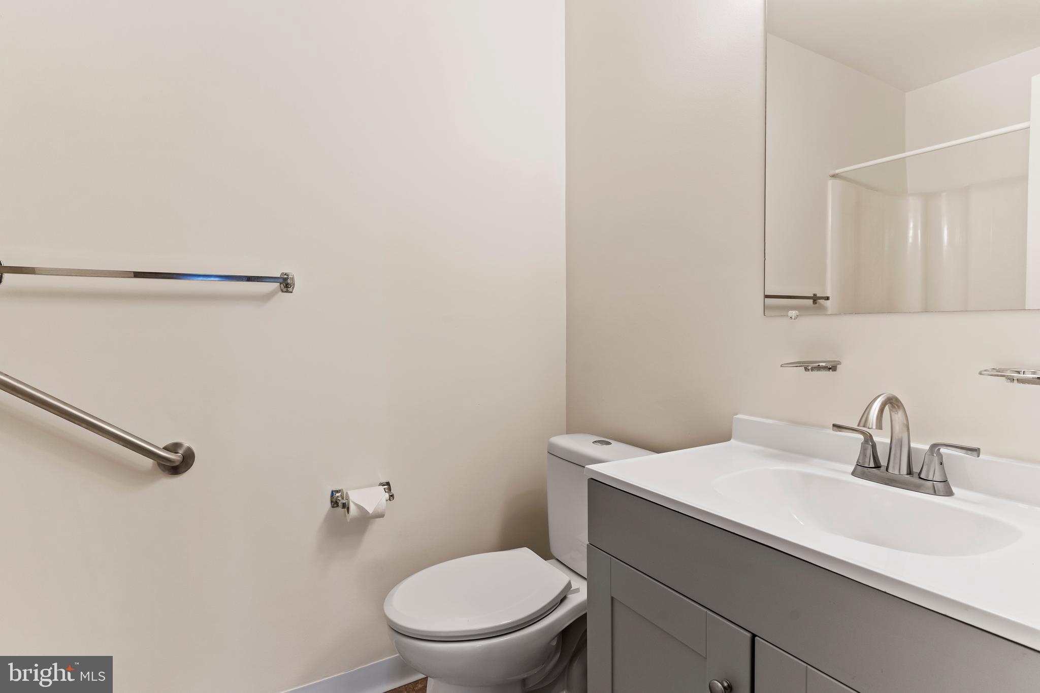 819 Brian Drive Enola, PA 17025 - Photo 14 of 22 a bathroom with a sink a toilet and a mirror