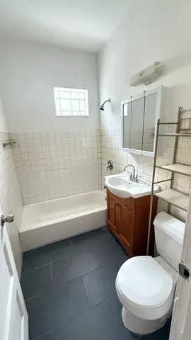 a bathroom with a toilet sink and bathtub