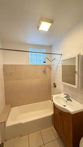 a bathroom with a bathtub and a sink