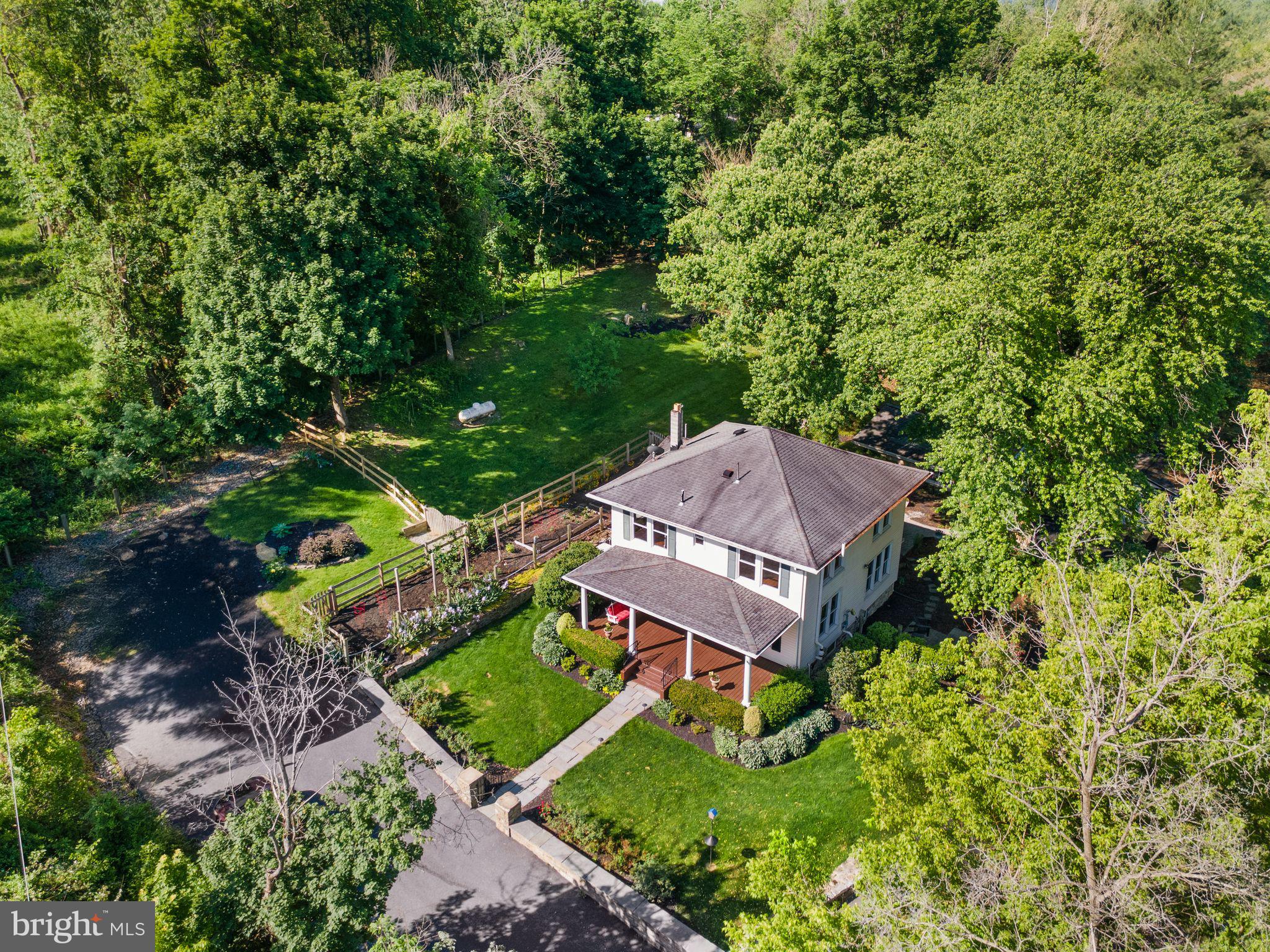 37151 Branchriver Road Purcellville, VA 20132 - Photo 56 of 63 an aerial view of a house with a garden and large trees