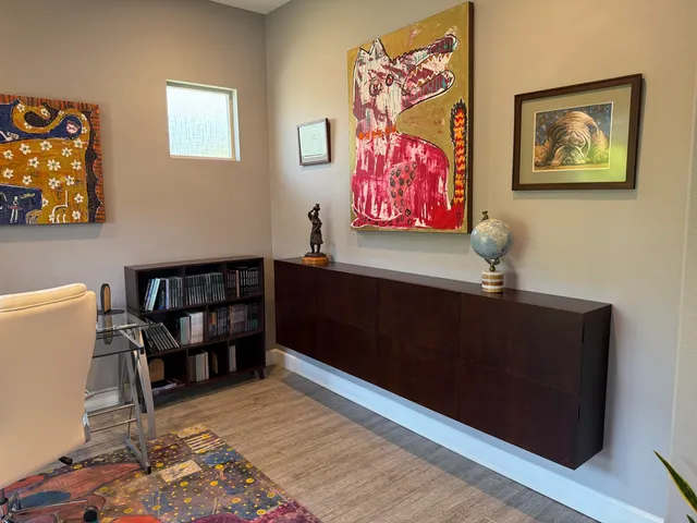 a view of a livingroom with furniture and workspace
