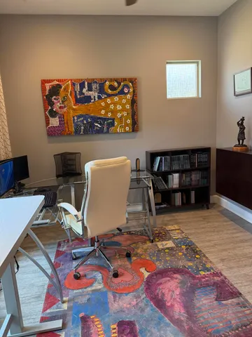 a workspace with furniture and rug