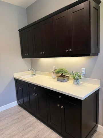 a bedroom with furniture and a large window