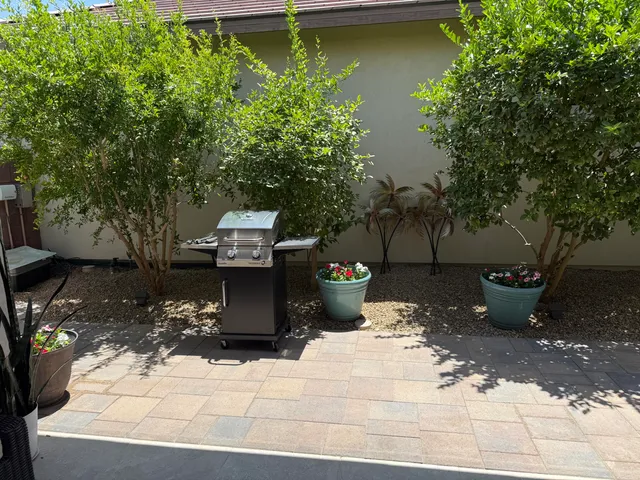 a view of swimming pool with a patio