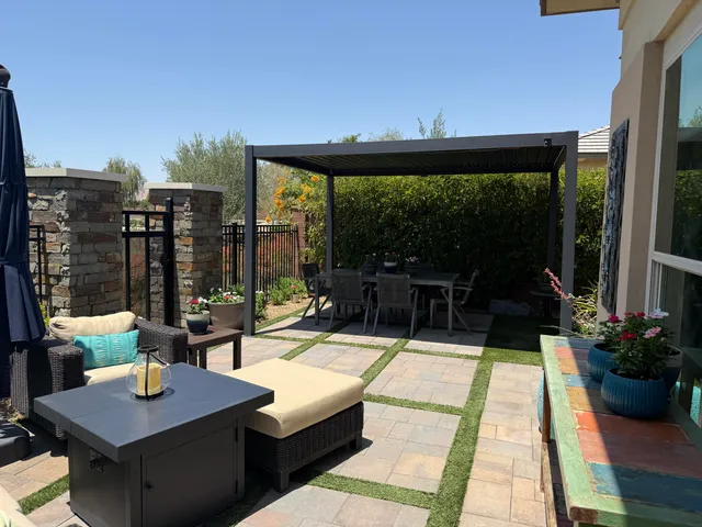 a view of a house with yard and sitting area
