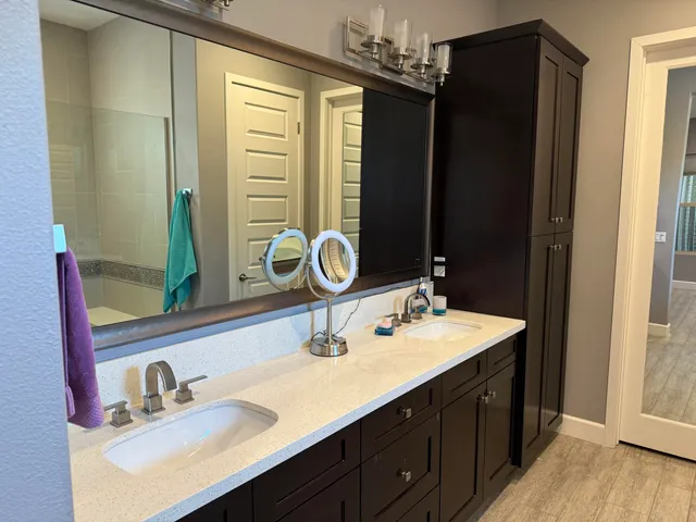 a bathroom with a sink and a mirror