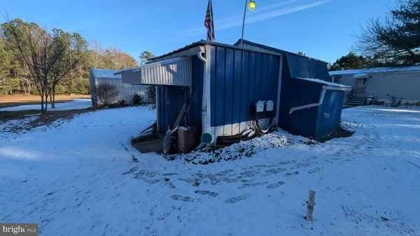 a view of a back yard of the house