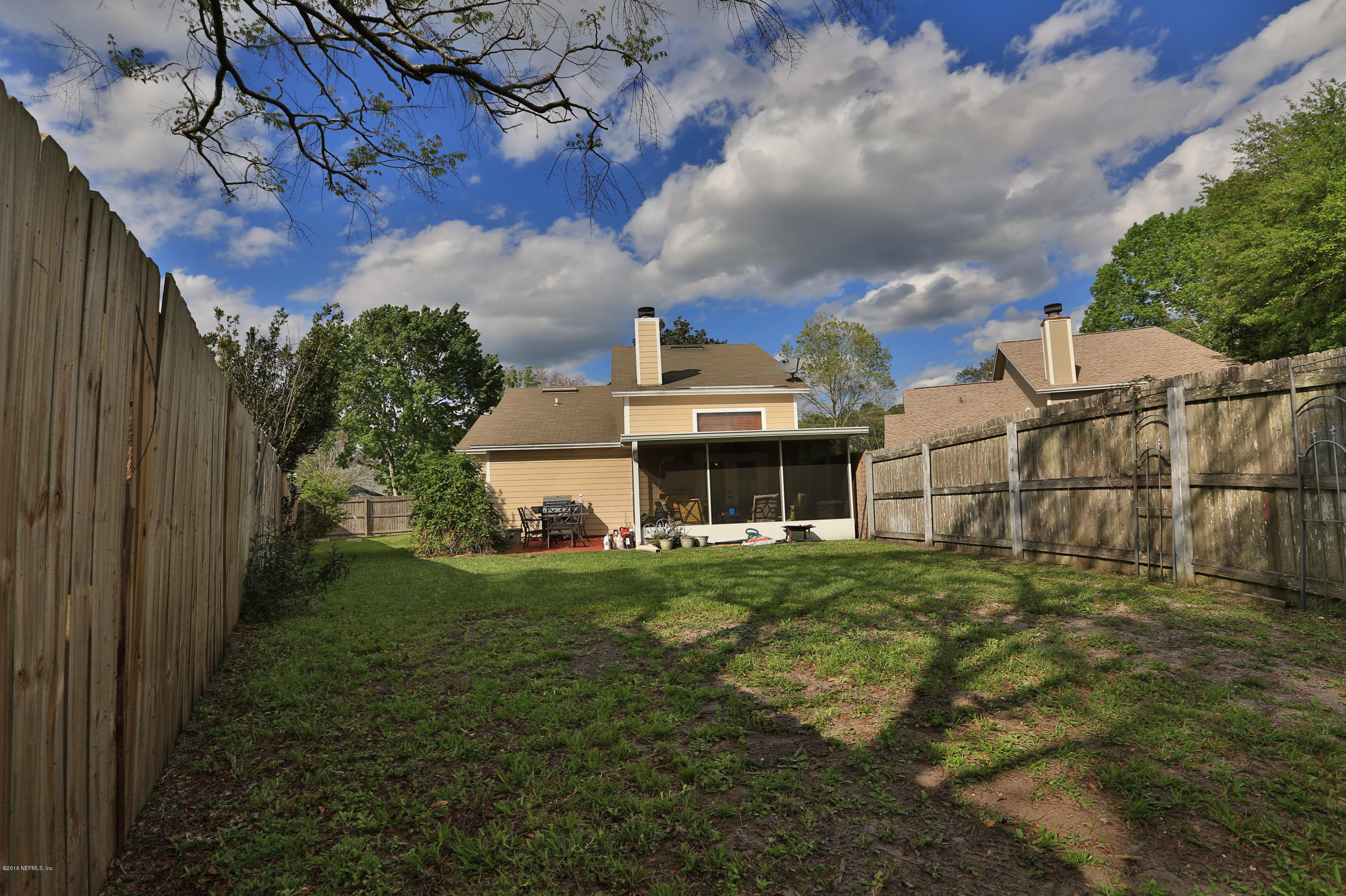 11784 Wattle Tree Road East Jacksonville, FL 32246 - Photo 5 of 24 a front view of a house with a garden